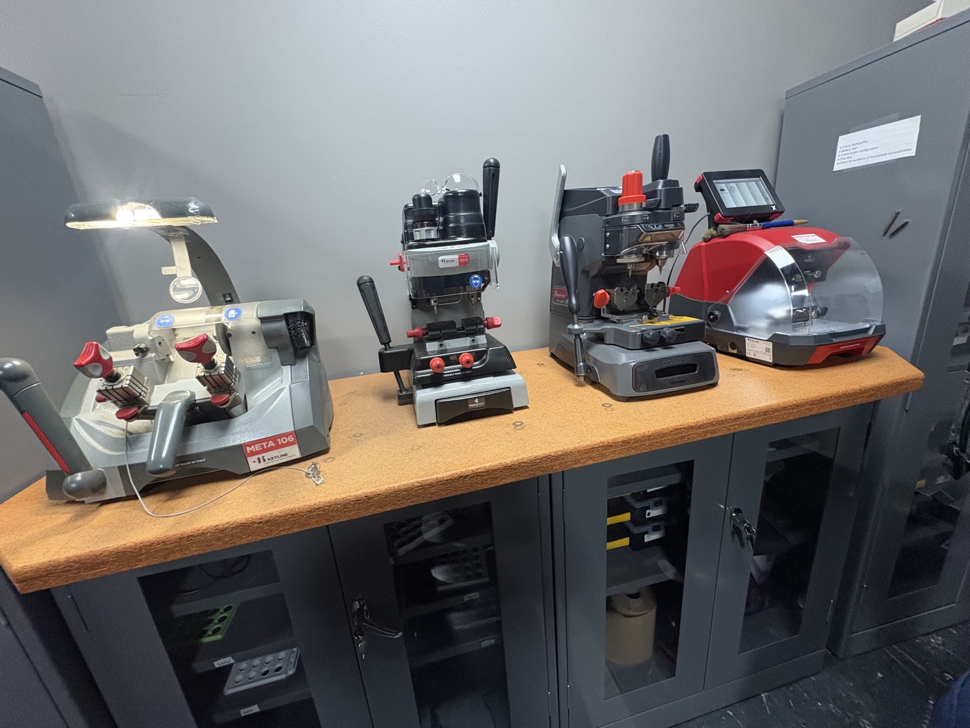 Professional key cutting and programming machines used by Peak Provisions technicians